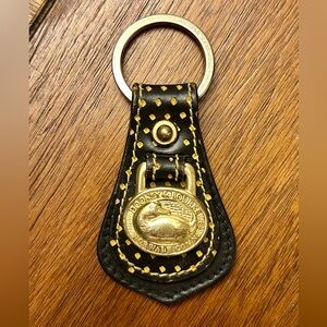 Dooney & Bourke Black Perforated Leather Keychain with Gold Accents.